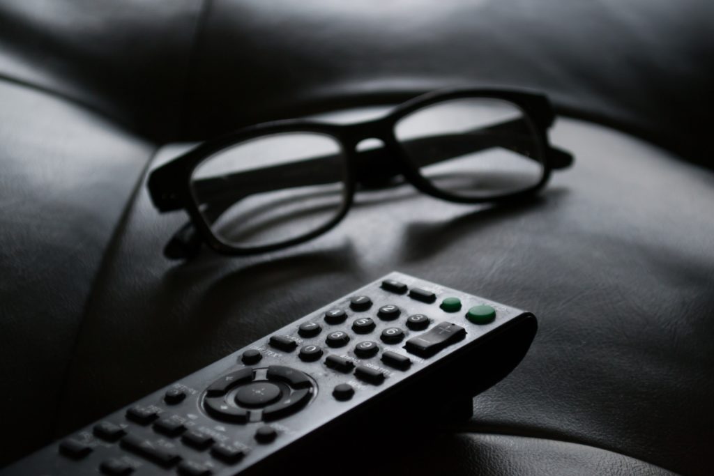 remote control and glasses