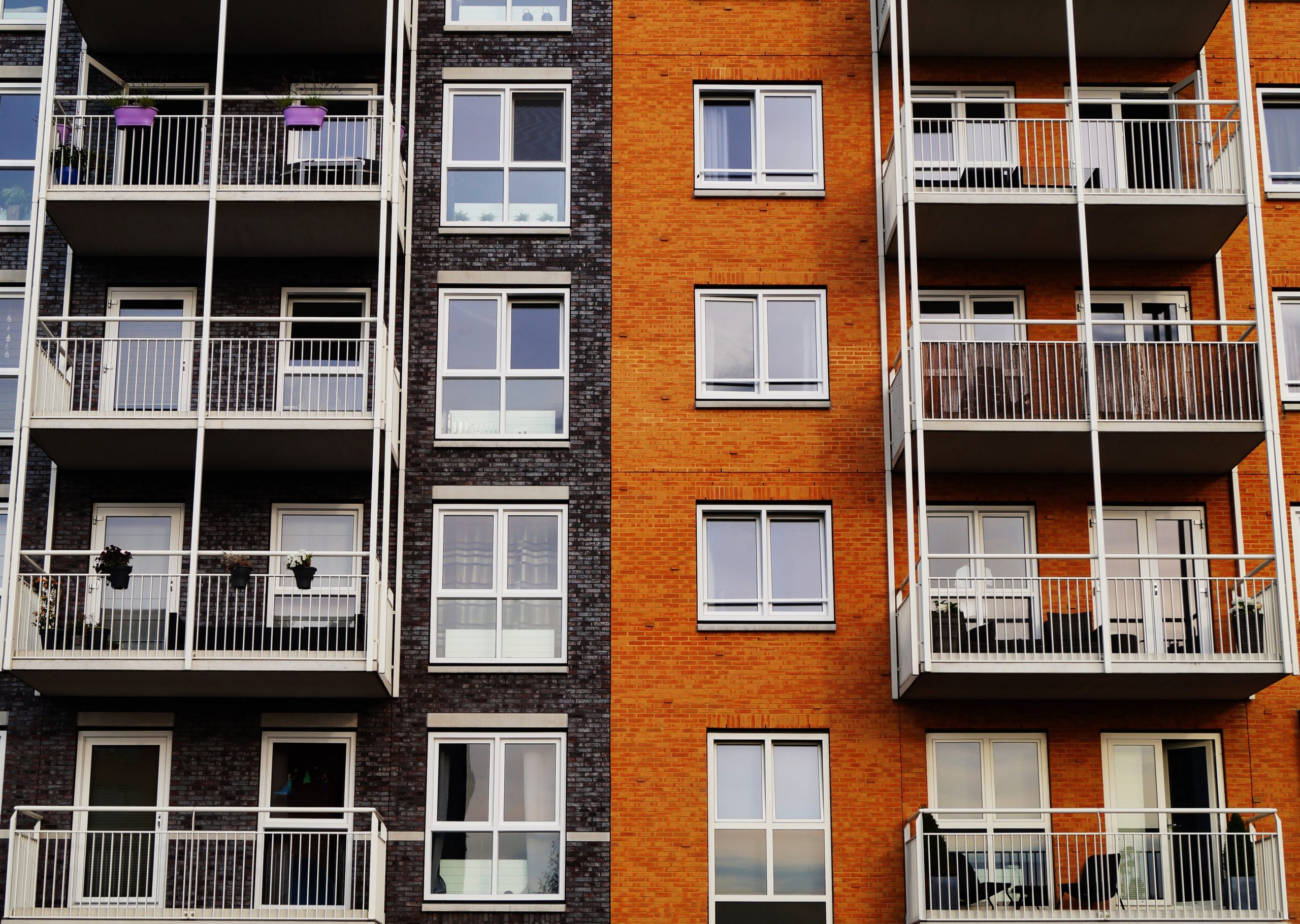 an apartment block from the outside showing the different floors of the building