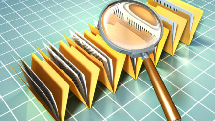 Graphic of files and magnifying glass