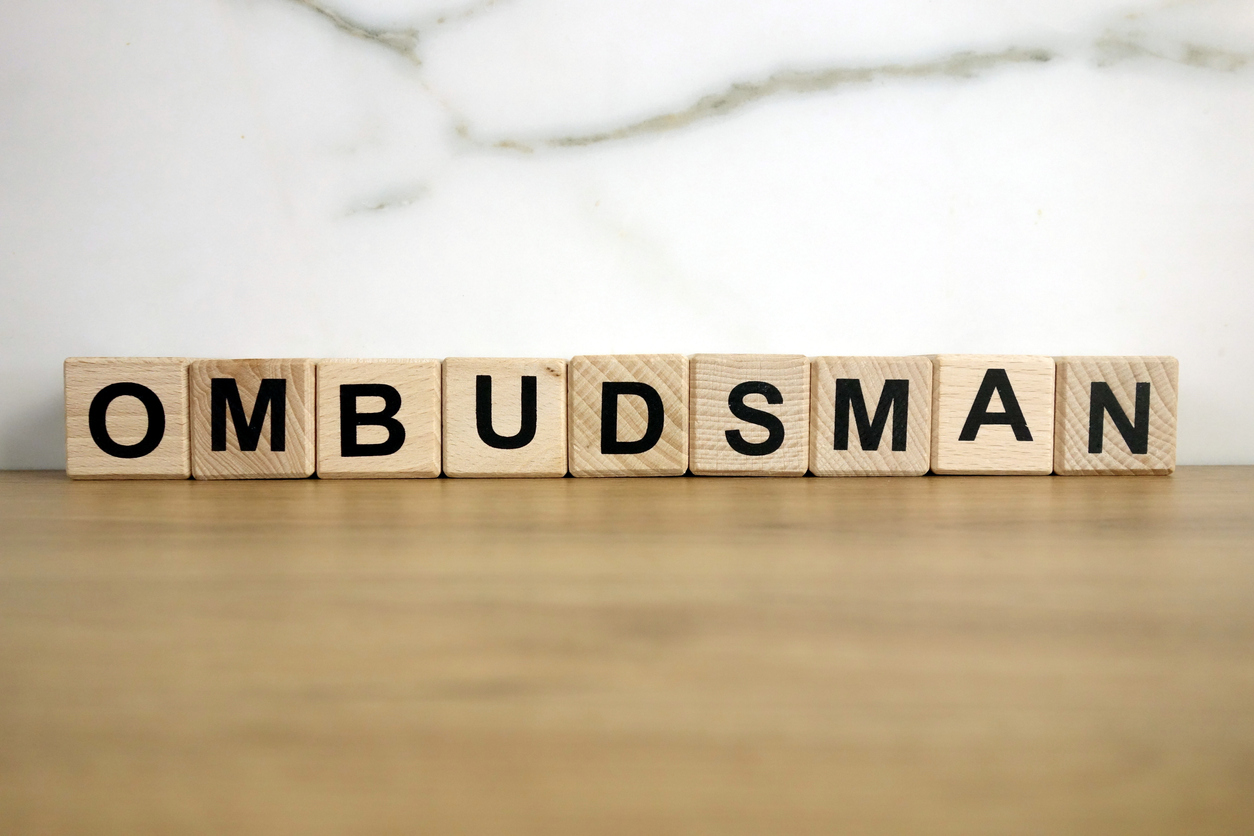 Photo of Ombudsman word from wooden blocks on desk