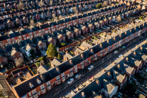 An aerial view of rows of back to back terraced houses in a working class area of a Northern town in England