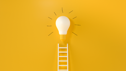 A ladder leading to a lightbulb on a bright yellow background